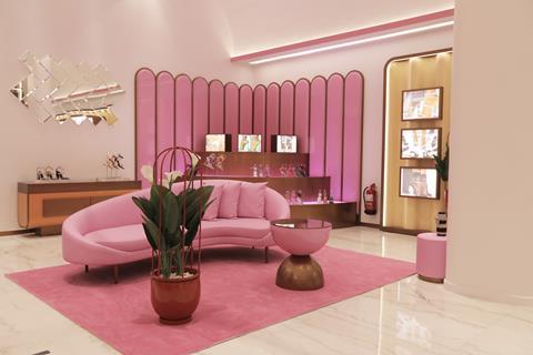 Interior of Public Desire shoe store in Riyadh, showing glamorous pink interiors including a sofa and a plant